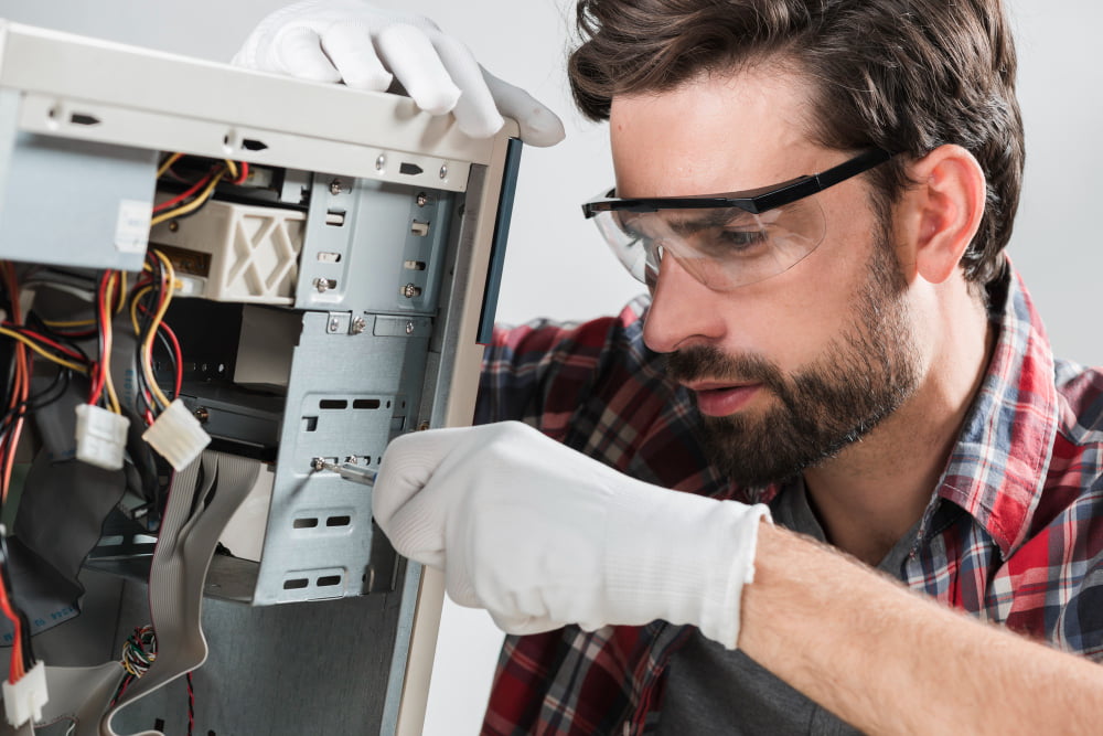 man-repairing-cpu-with-screwdriver