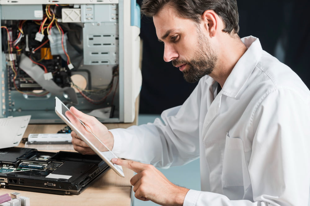 side-view-male-technician-using-digital-tablet